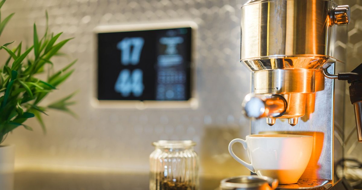 A rich espresso shot with golden crema poured into a white ceramic cup