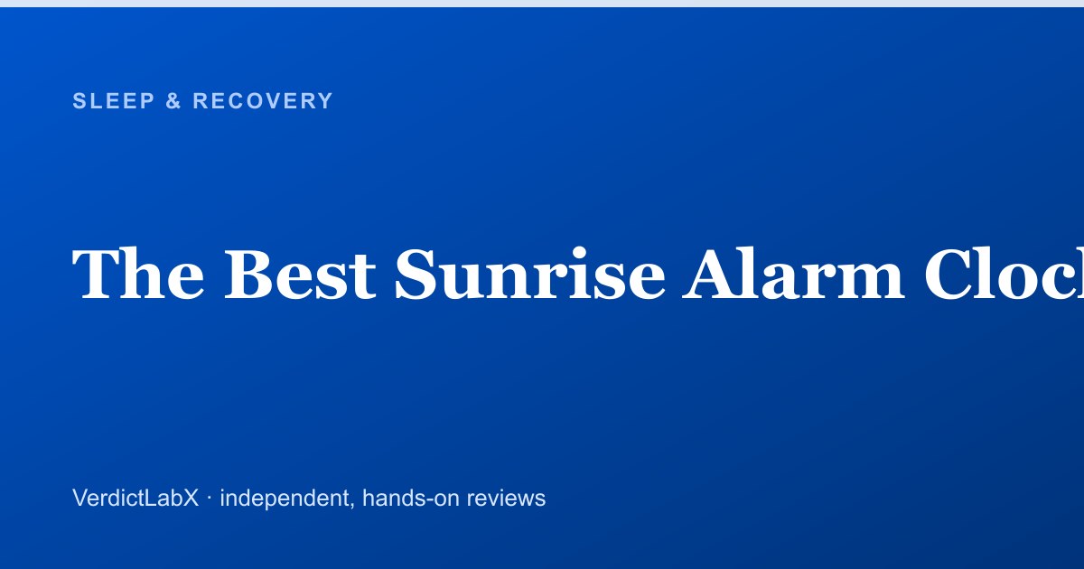 A sunrise alarm clock glowing warmly on a bedside table at dawn